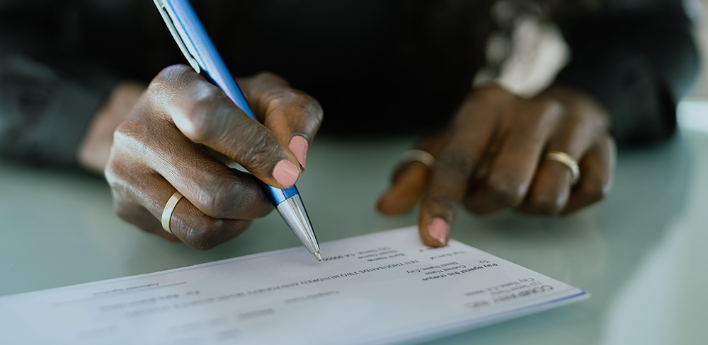 Payroll - Person signing check